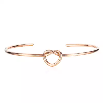 Kerek acél karkötő,szív alakú csomó, réz színű