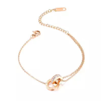 Acél réz színű karkötő - egy karika római számokkal, és egy cirkóniás karikával