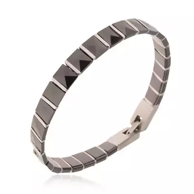 Fekete kerámia karkötő, piramis alakú részek, acél sávok