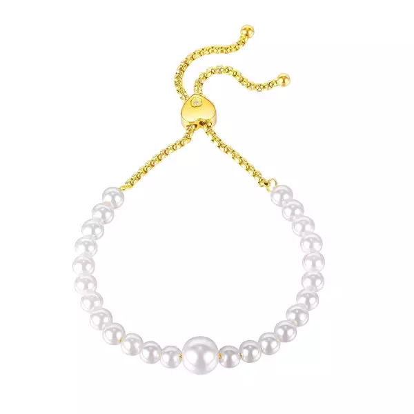 Acél karkötő arany színben - gyöngyházfényű fehér gyöngyök, átlátszó cirkónia, csúszó zárral