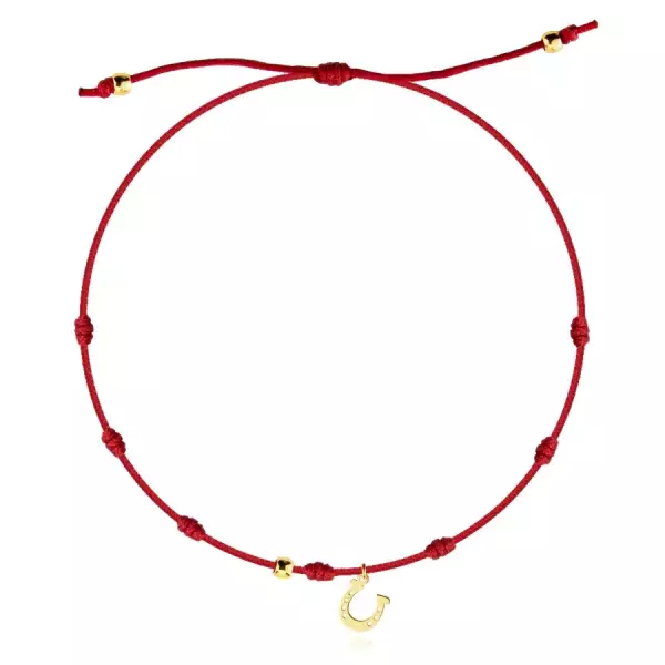 Állítható karkötő medállal 585 aranyból - lópatkó, piros zsinórral