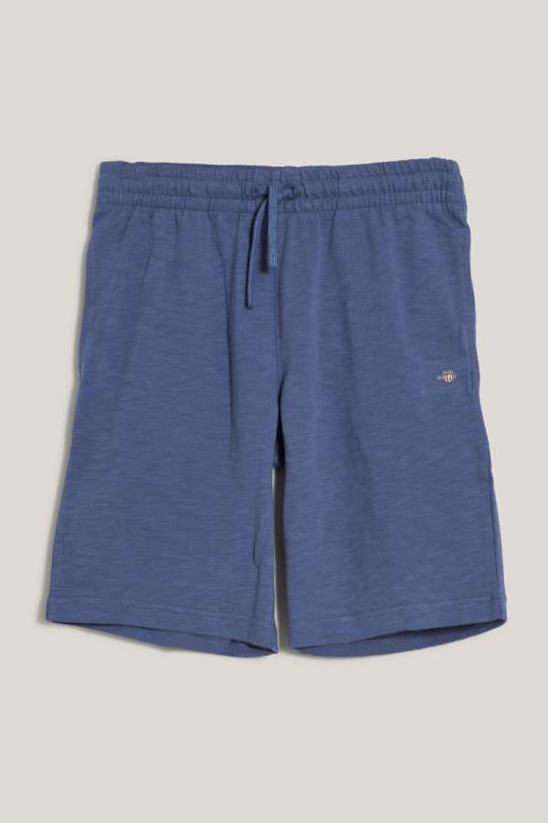 TRÉNINGRUHA RÖVIDNADRÁG GANT SHIELD COTTON SLUB SHORTS DUSTY NAVY