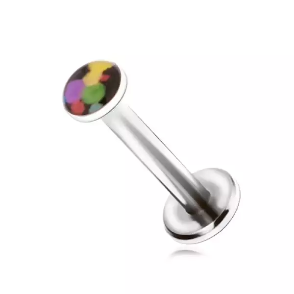 Piercing állba, acélból, színes foltok fekete alapon